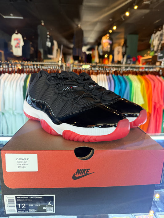 JORDAN 11 LOW BRED